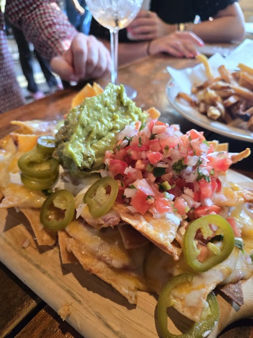Loaded nachos with guacamole, pico de gallo and jalapeños